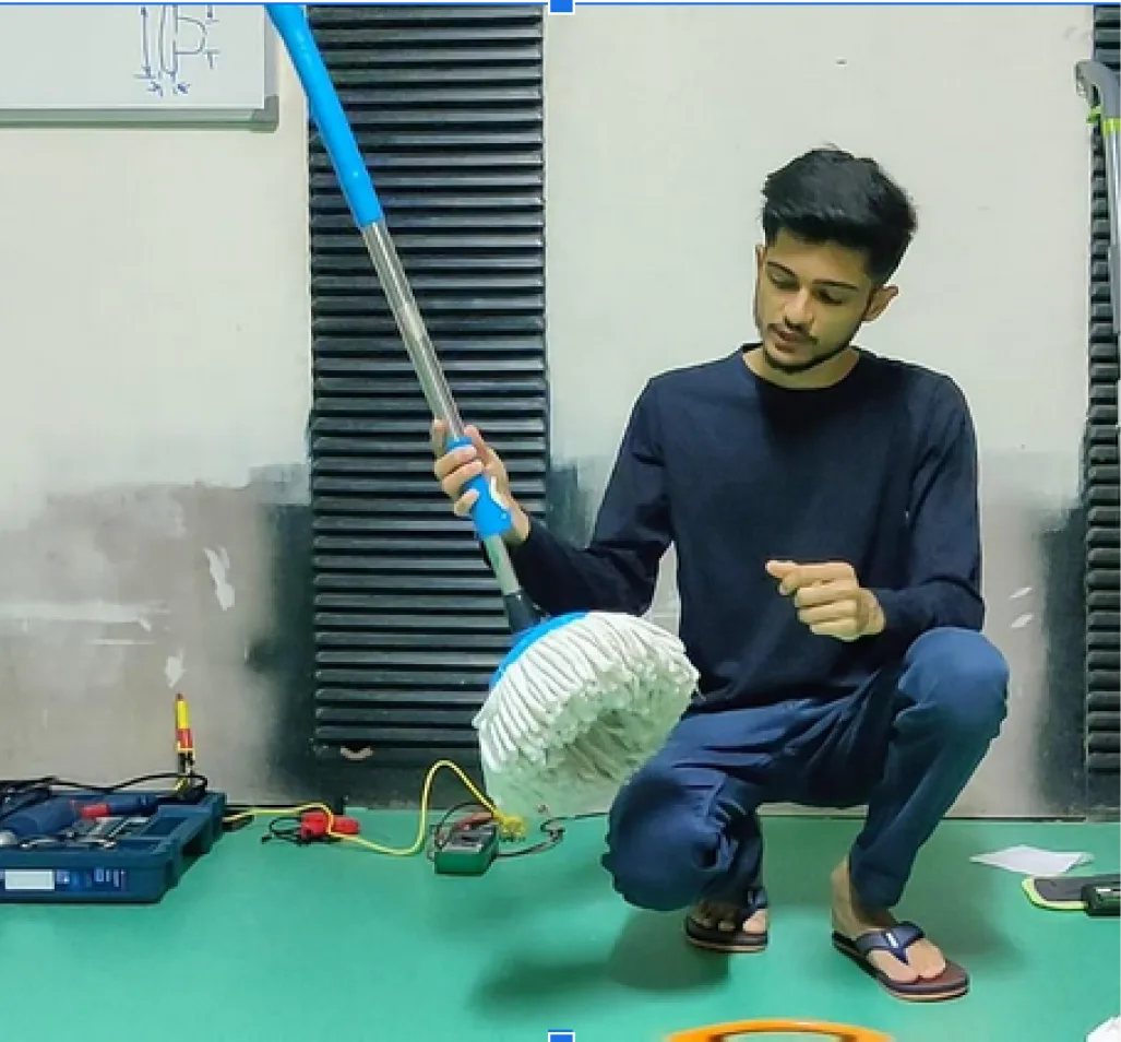 An early Smart Mop prototype being tested on the workshop floor